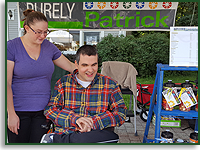 Self-advocate, Patrick Lewis, sits with jars of baking ingredeients for his small business.