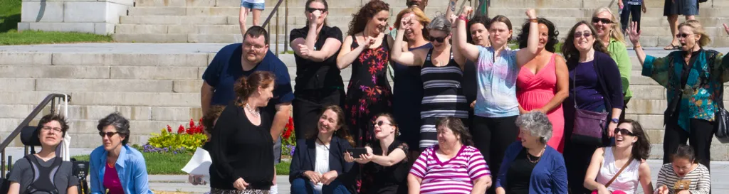 Leadership graduates sit on the steps of the Vermont Statehouse.